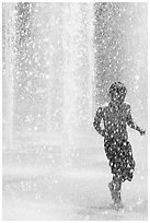 Boy refreshing himself  Cesar de Chavez Park. San Jose, California, USA (black and white)