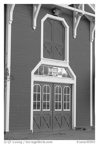 Door with sunset reflections, Red Barn. Stanford University, California, USA (black and white)