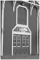 Door with sunset reflections, Red Barn. Stanford University, California, USA (black and white)