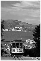 Cable car and Alcatraz Island, late afternoon. San Francisco, California, USA (black and white)