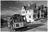 Cable car climbing, and Tudor house, late afternoon. San Francisco, California, USA (black and white)