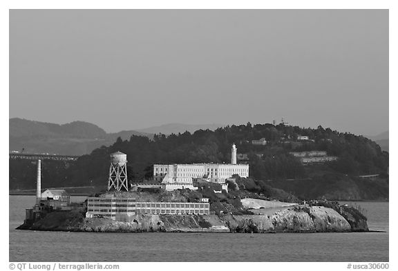 Alcatraz Island at sunset, with Yerba Buena Island in the background. San Francisco, California, USA