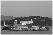 Alcatraz Island at sunset, with Yerba Buena Island in the background. San Francisco, California, USA (black and white)