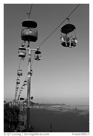 Sky glider Riders enjoy the last sunrays of the day. Santa Cruz, California, USA