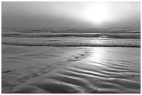 Foggy sunset over the ocean. Morro Bay, USA (black and white)