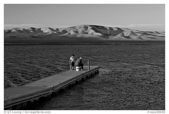 Fishing on San Luis Reservoir at sunset. California, USA