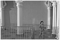 Indian girl running in the Sikh Gurdwara Temple, late afternoon. San Jose, California, USA (black and white)