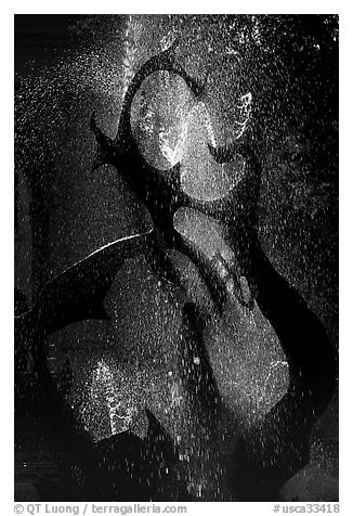Modern fountain with water drops, late afternoon. Stanford University, California, USA (black and white)