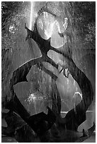 Modern fountain (The Claw) with water streaks, late afternoon. Stanford University, California, USA ( black and white)