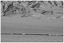 Freight train in desert valley. Mojave National Preserve, California, USA (black and white)