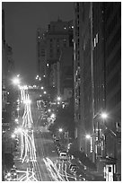 Steep California street and lights at night. San Francisco, California, USA (black and white)