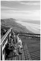 Enjoying sunset from the observation platform at Fort Funston. San Francisco, California, USA ( black and white)