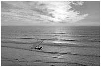 Hang glider flying  above ocean, Fort Funston, sunset. San Francisco, California, USA ( black and white)