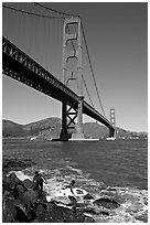 Surfers below the Golden Gate Bridge. San Francisco, California, USA (black and white)