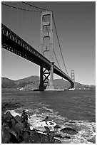 Surfers below the Golden Gate Bridge. San Francisco, California, USA (black and white)