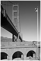 Fort Point courtyard, flag pole, and Golden Gate Bridge. San Francisco, California, USA (black and white)