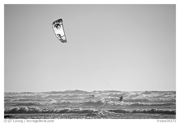 Kitesurfer in powerful waves, afternoon. San Francisco, California, USA