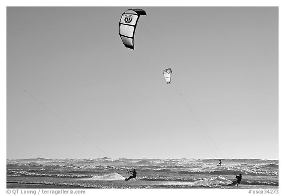 Kite surfers and Pacific Ocean waves, late afternoon. San Francisco, California, USA