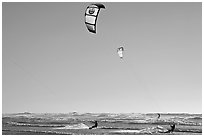 Kite surfers and Pacific Ocean waves, late afternoon. San Francisco, California, USA ( black and white)