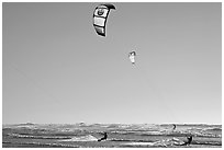 Kite surfers and Pacific Ocean waves, late afternoon. San Francisco, California, USA ( black and white)