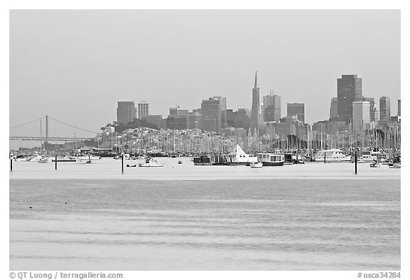 Alcatraz Island and Bay Bridge, painted in pink hues at sunset. San Francisco, California, USA (black and white)