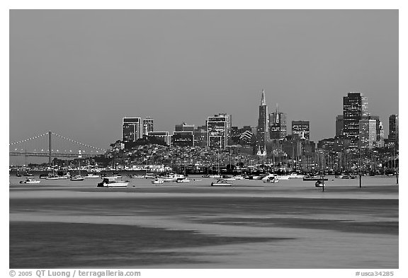 Harbor in Richardson Bay with houseboats and city skyline at dusk. San Francisco, California, USA (black and white)