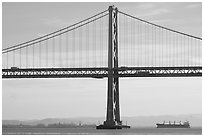 Traffic on Oakland Bay Bridge and tanker ship. San Francisco, California, USA ( black and white)