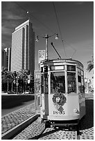 Historic trolley car and Embarcadero center building. San Francisco, California, USA (black and white)