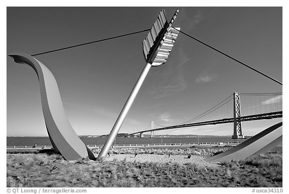 Modern sculputure called Cupid's arrow, framing the Bay Bridge. San Francisco, California, USA