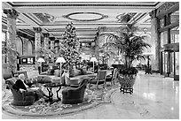 Man sitting in the lobby of the Fairmont Hotel. San Francisco, California, USA (black and white)