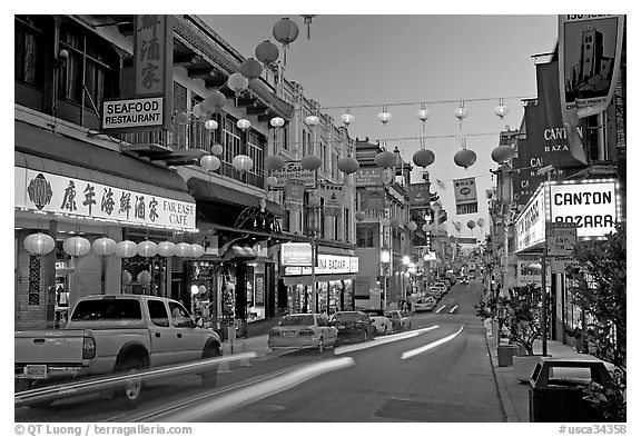 Lanterns and lights on Grant Street at dusk, Chinatown. San Francisco, California, USA (black and white)