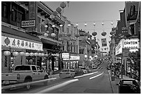 Lanterns and lights on Grant Street at dusk, Chinatown. San Francisco, California, USA (black and white)