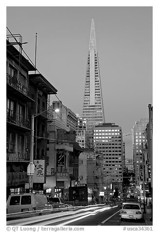 Chinatown street and Transamerica Pyramid, dusk. San Francisco, California, USA