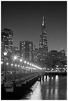 Transamerica Pyramid and Pier seven reflections at night. San Francisco, California, USA ( black and white)