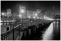 Embarcadero and Transamerica Pyramid seen from Pier 7 at night. San Francisco, California, USA (black and white)