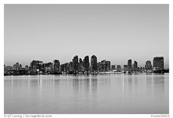 Skyline reflected in the waters of harbor, dawn. San Diego, California, USA