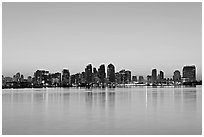 Skyline reflected in the waters of harbor, dawn. San Diego, California, USA ( black and white)