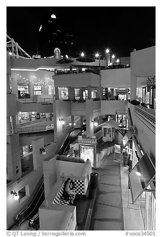 Some of the 140 stores in the Horton Plaza shopping mall at night. San Diego, California, USA (black and white)