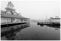 Period and modern boathouses in fog, Coronado. San Diego, California, USA (black and white)