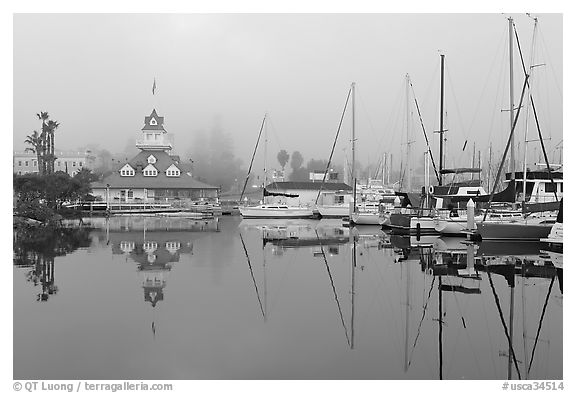 Boats and historic Coronado boathouse in fog. San Diego, California, USA (black and white)