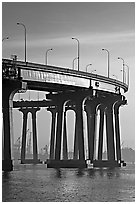 Section of Coronado-San Diego Bay Bridge seen from Coronado, early morning. San Diego, California, USA (black and white)