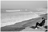 Woman reading on the beach. La Jolla, San Diego, California, USA (black and white)