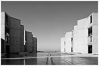 Watercourse bisecting travertine courtyard, Salk Institute. La Jolla, San Diego, California, USA (black and white)