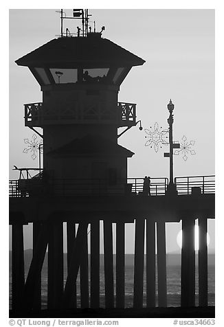 Lifeguard tower on Huntington Pier at sunset. Huntington Beach, Orange County, California, USA