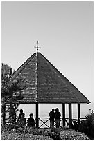 People standing in a Heisler Park Gazebo. Laguna Beach, Orange County, California, USA (black and white)