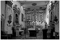 Altar and baroque retablo in the Serra Chapel. San Juan Capistrano, Orange County, California, USA (black and white)