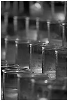 Candles in red glass, background blurred. San Juan Capistrano, Orange County, California, USA (black and white)