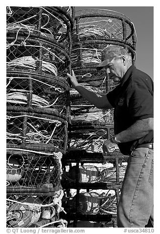 Man loading crab traps. Morro Bay, USA