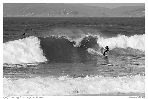 Surfer and wave. Morro Bay, USA