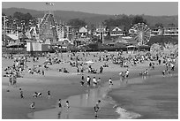 Beach and seaside amusement park on a summer afternoon. Santa Cruz, California, USA (black and white)